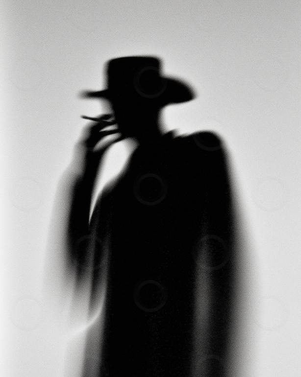 Monochrome cowboy silhouette smoking in haze.