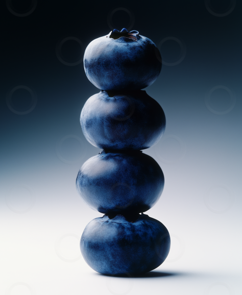 Blueberries stacked on top of each other with dramatic studio lighting.